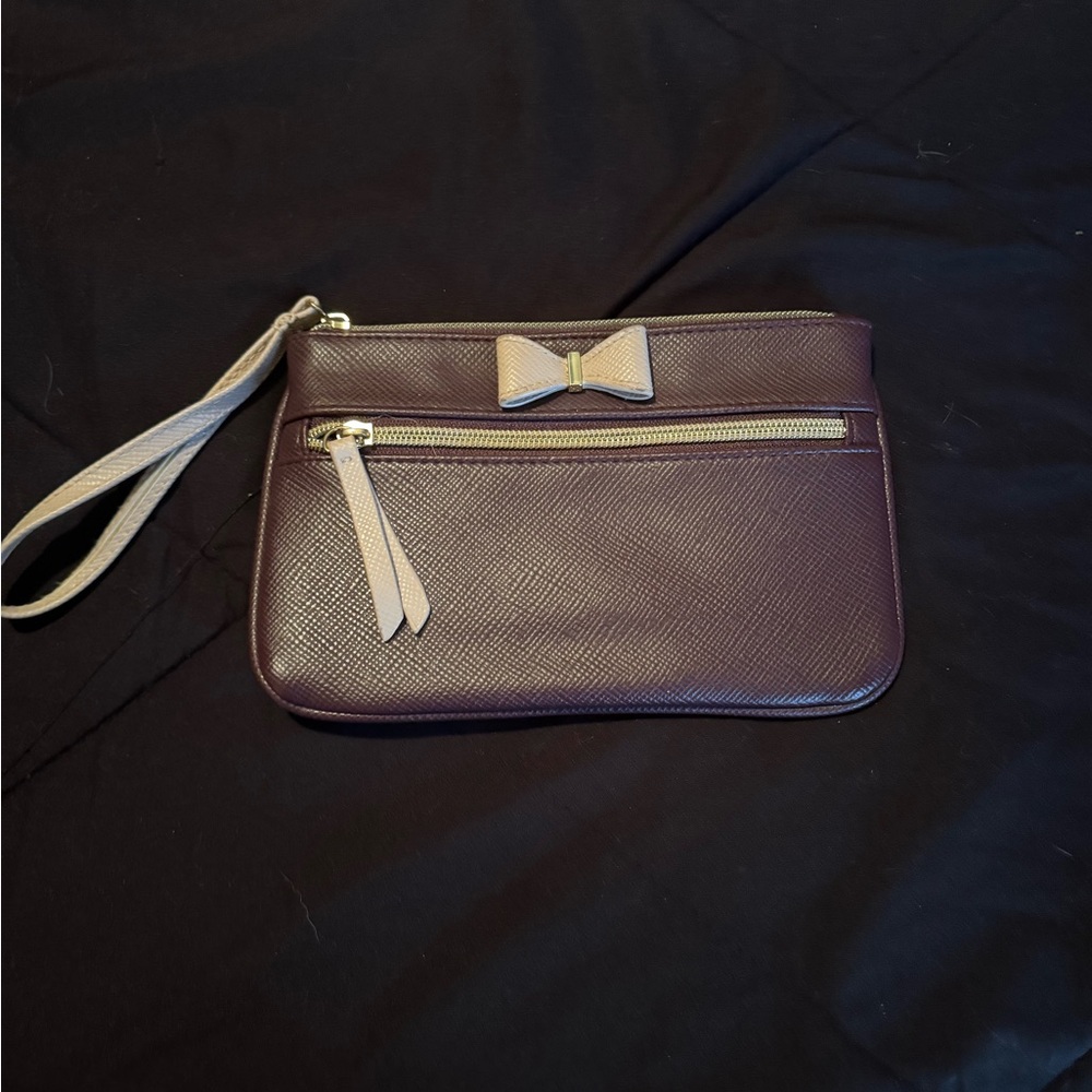 Dark purple wristlet with small bow.